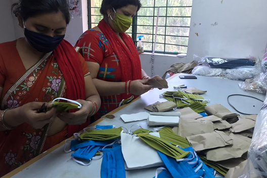 EMPLOYEES MAKING FACE MASKS 